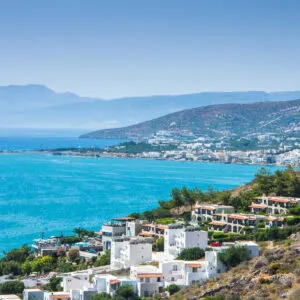 Whitewashed hillside townscape of Elounda, Crete, Greece