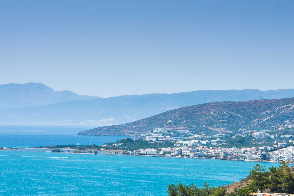 Whitewashed hillside townscape of Elounda, Crete, Greece