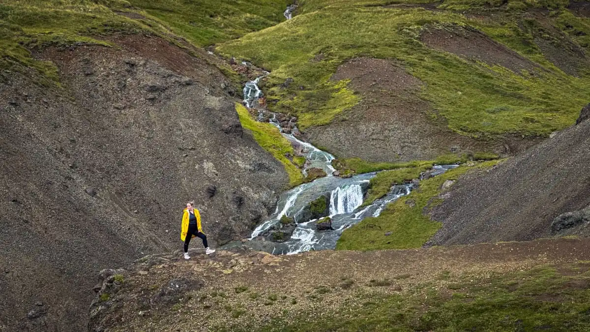 Woman in front of waterfall in Iceland (1)