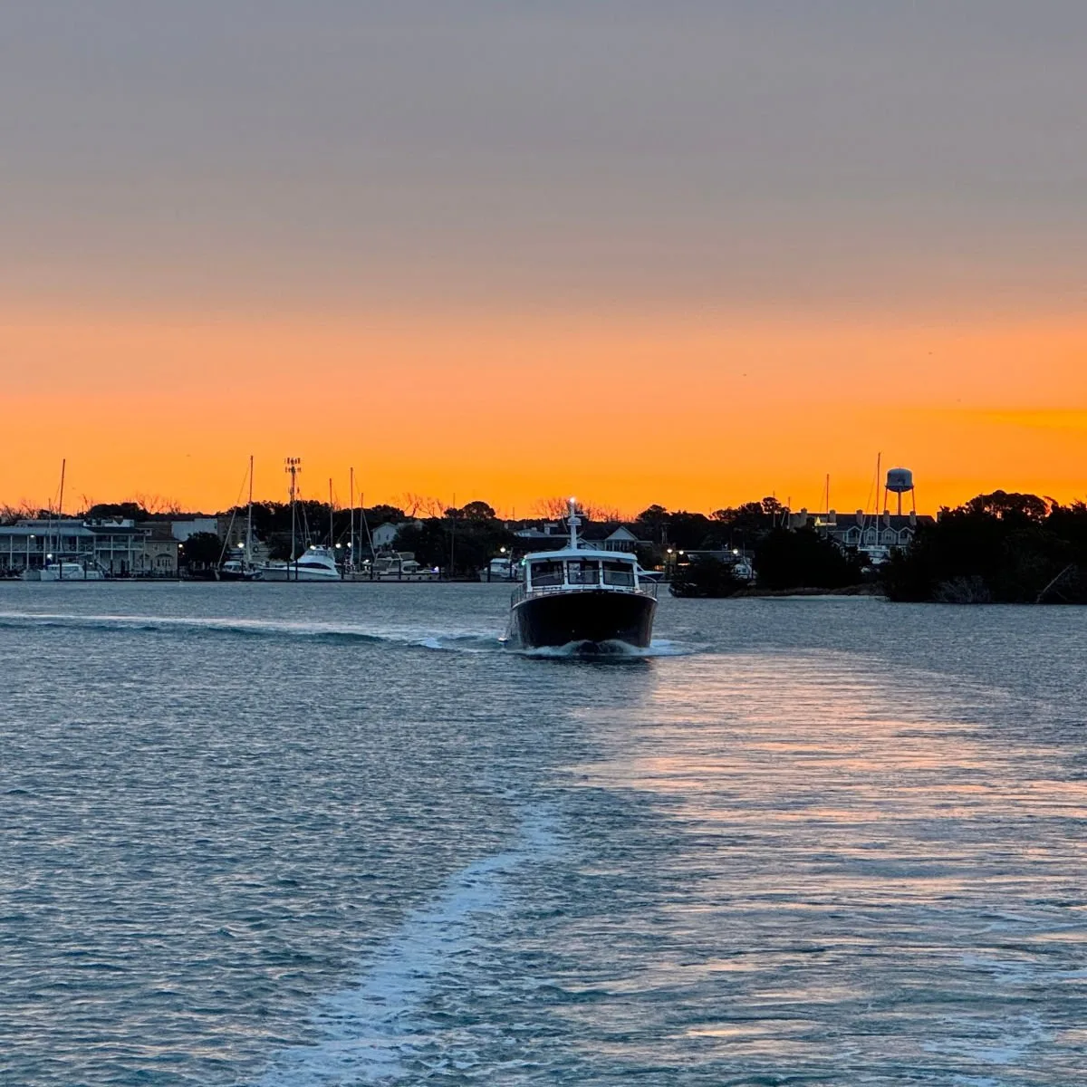 Boat cruising at sundwon in Morehead City, NC