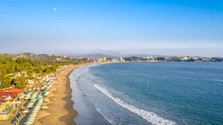 Miramar Beach, in Manzanillo, Colima, is a long stretch of golden sand with medium waves, ideal for swimming and surfing. Popular with both tourists and locals.