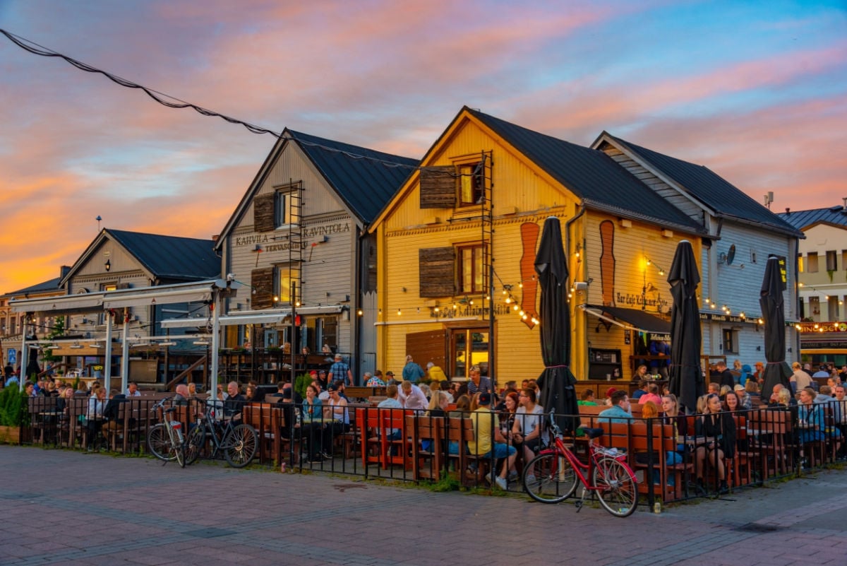 Experts Reveal 2026's Top 10 Hidden Gems (And A Quiz To Find Yours) Sunset view of Kauppatori square in Finnish town Oulu