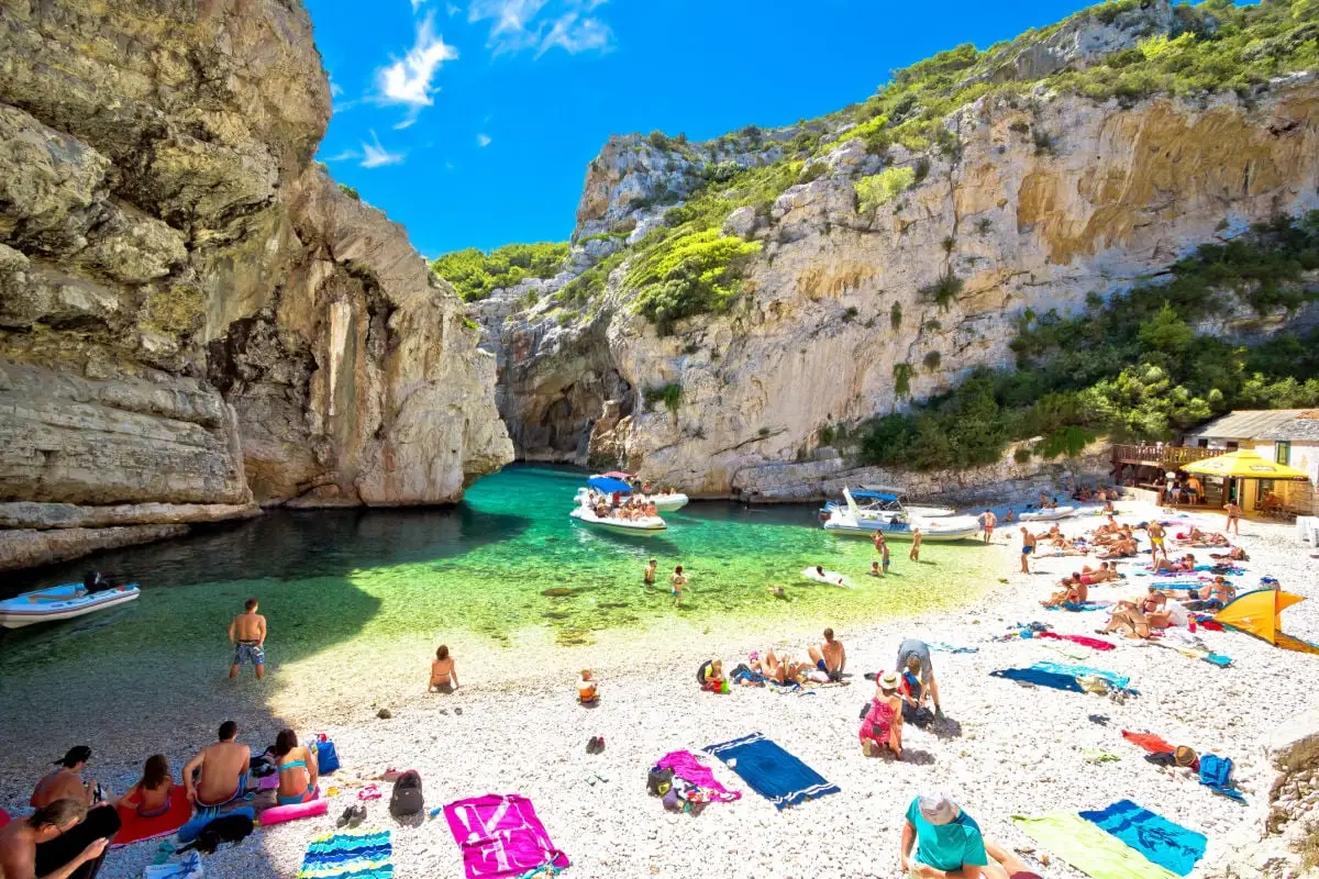 Experts Reveal 2026's Top 10 Hidden Gems (And A Quiz To Find Yours) Vis, Croatia, Famous Stiniva beach on Vis island summer view. Beach is located in stone canyon and is amazing geological phenomenon. Famous tourist destination in Dalmatia, Croatia.