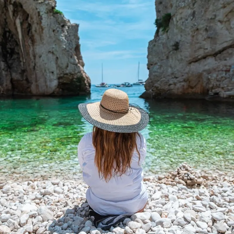 Young Woman Relaxing On A Beach In Vis, Croatia