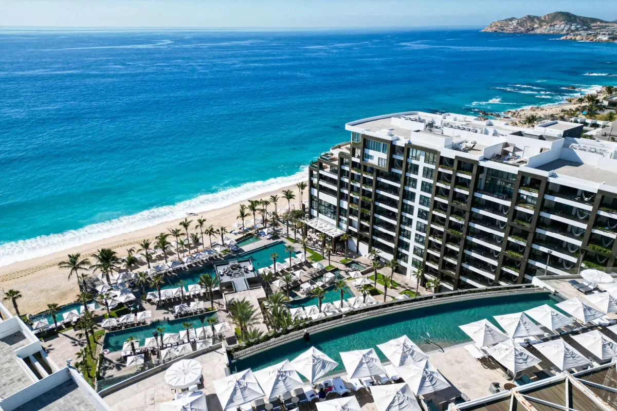 Aerial view of Garza Blanca Los Cabos with rooftop pool in foreground