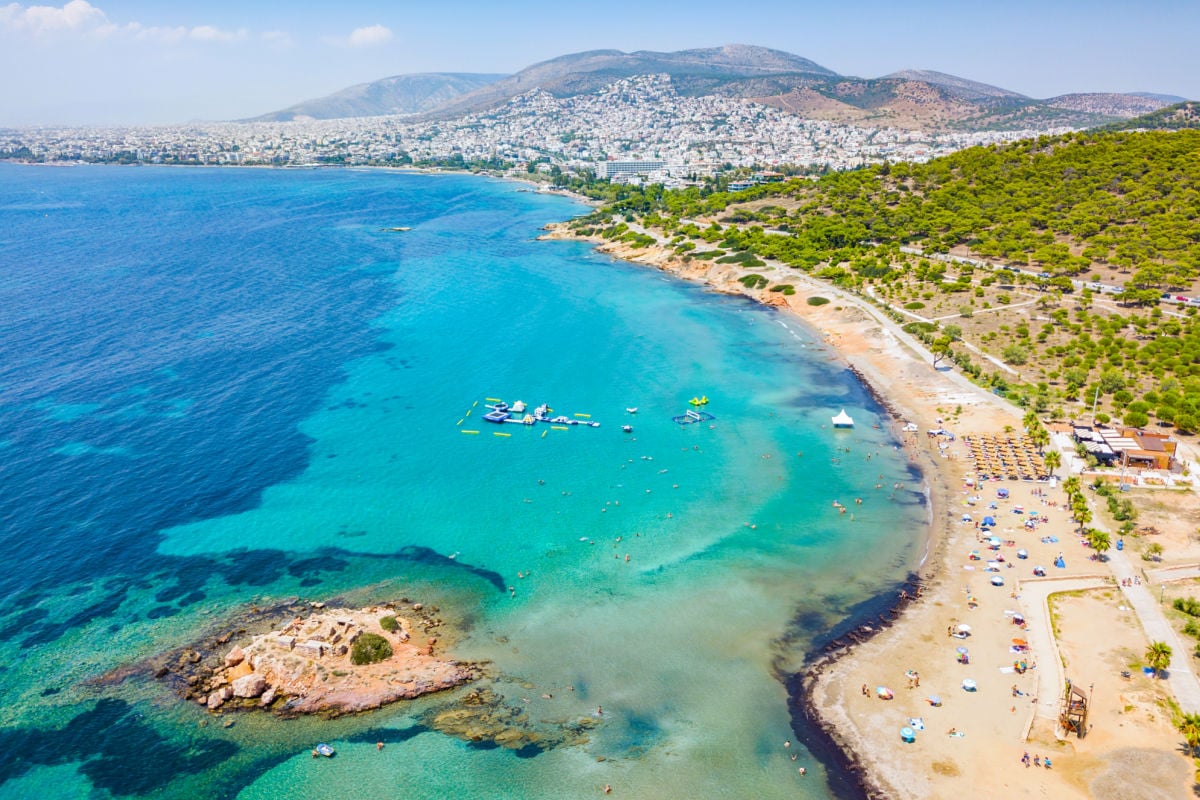 Aerial view of the Beach of Kavouri in south Athens, Greece, with turquoise waters and view to the city