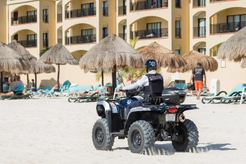 Cancun Police Officer on 4 wheeler on beach