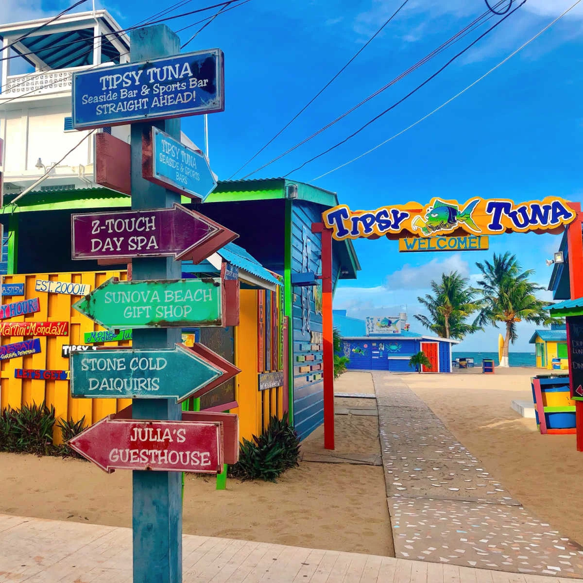 Colorful street sign on the beachfront Placencia, Belize