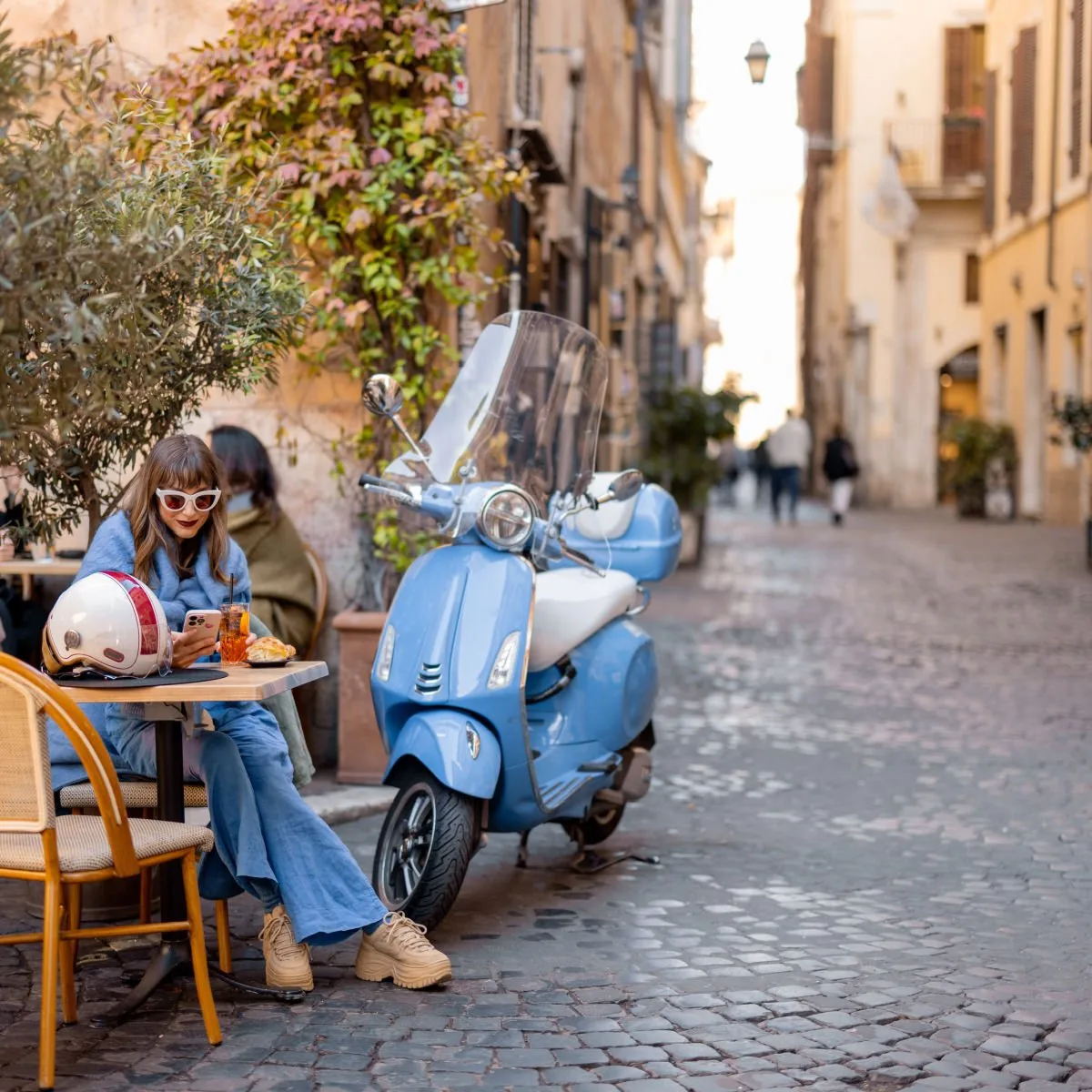 Sidewalk cafe on cobbled Rome street