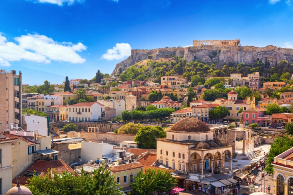 Skyline of Athens with Monastiraki square and Acropolis hill during summer sunny day before sunset. Athens, Greece
