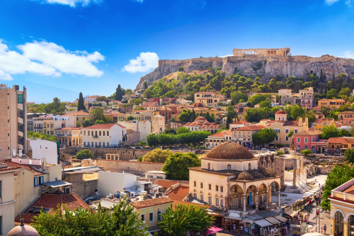 Skyline of Athens with Monastiraki square and Acropolis hill during summer sunny day before sunset. Athens, Greece