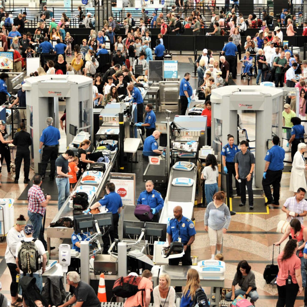 TSA agents handling airport crowds