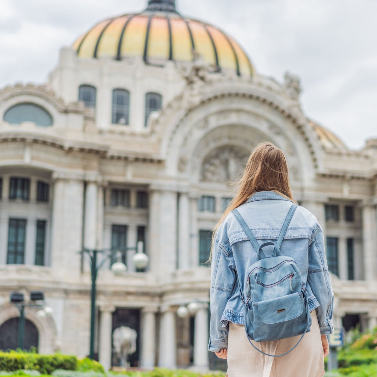 Tourist with backpack visiting Bellas Artes in CDMX