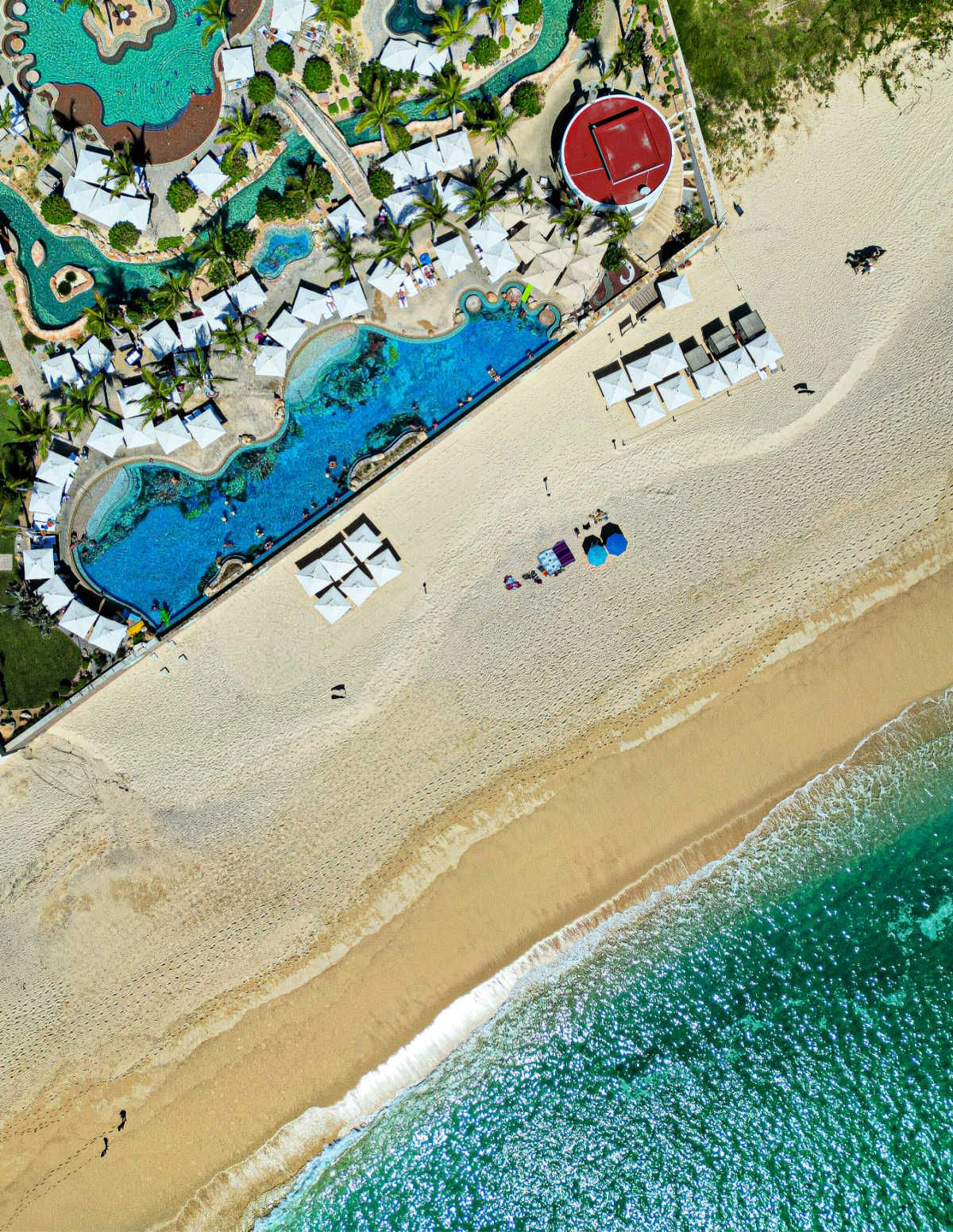Aerial view of Beach, ocean, and pools of Villa La Valencia in Los Cabos