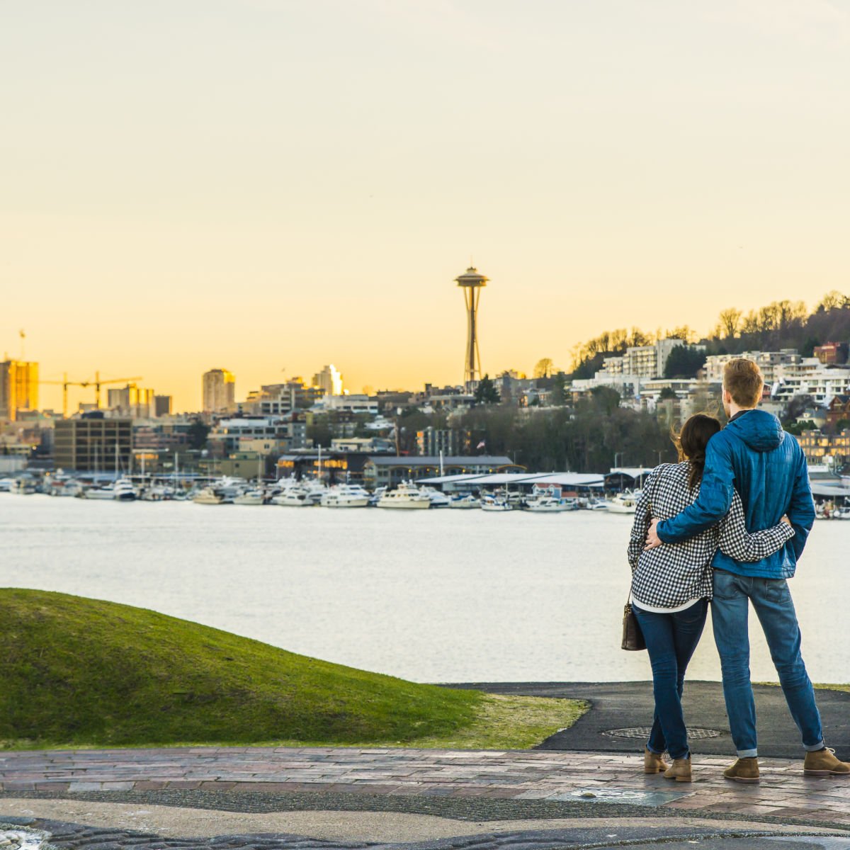 Couple in winter wear enjoying view of Seattle skyline