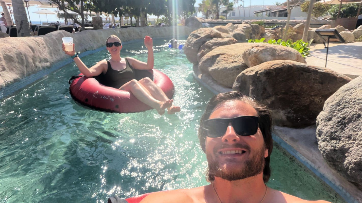 Man and woman in Lazy river at Villa La Valencia in Los Cabos