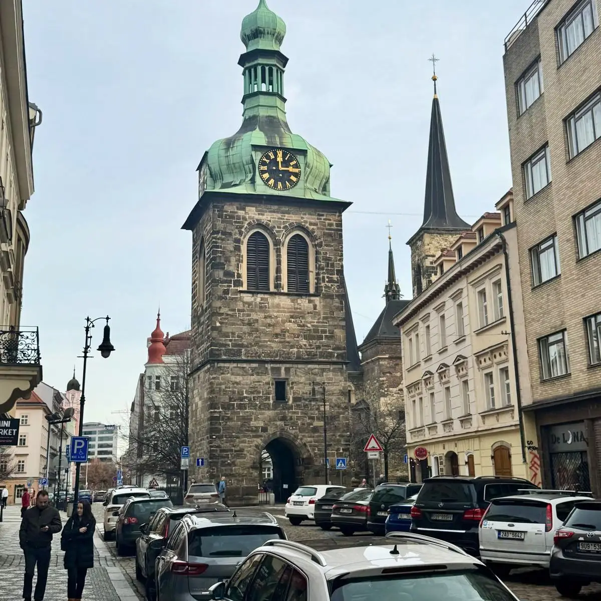 Medieval clock tower and archway in Prague