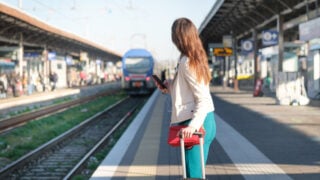Female passenger at undisclosed train station