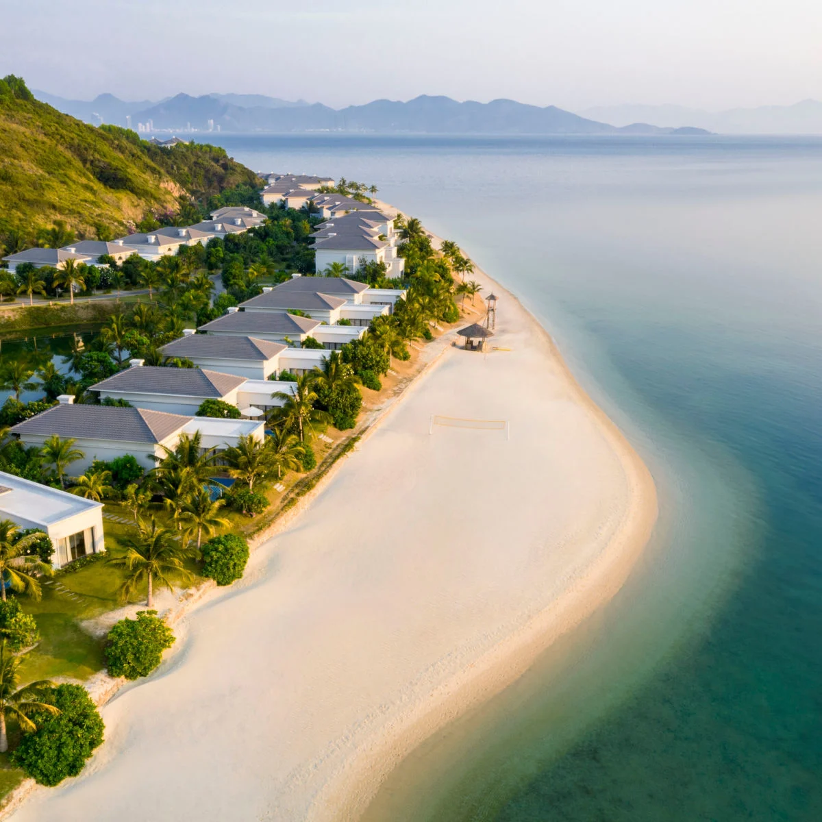 Pristine beach along row of vacation homes in Phu Quoc