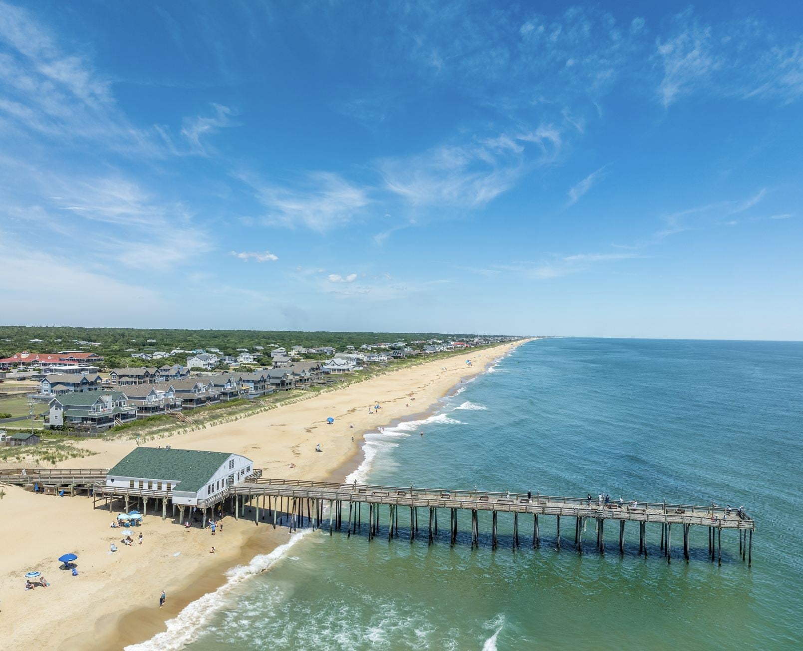 Aerial view of the Kitty Hawk Pier and beach popular tourist vacation destination in the Outer Banks, North Carolina