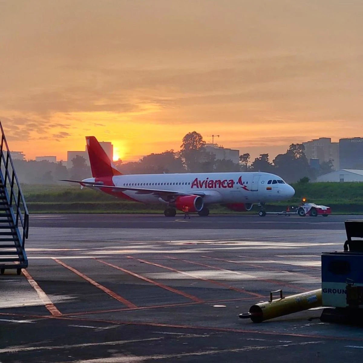 Avianca plane on runway at sundown