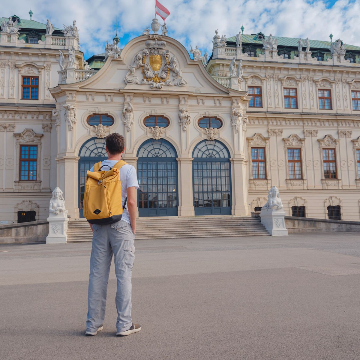 Backpacker visiting palace in Vienna, Austria
