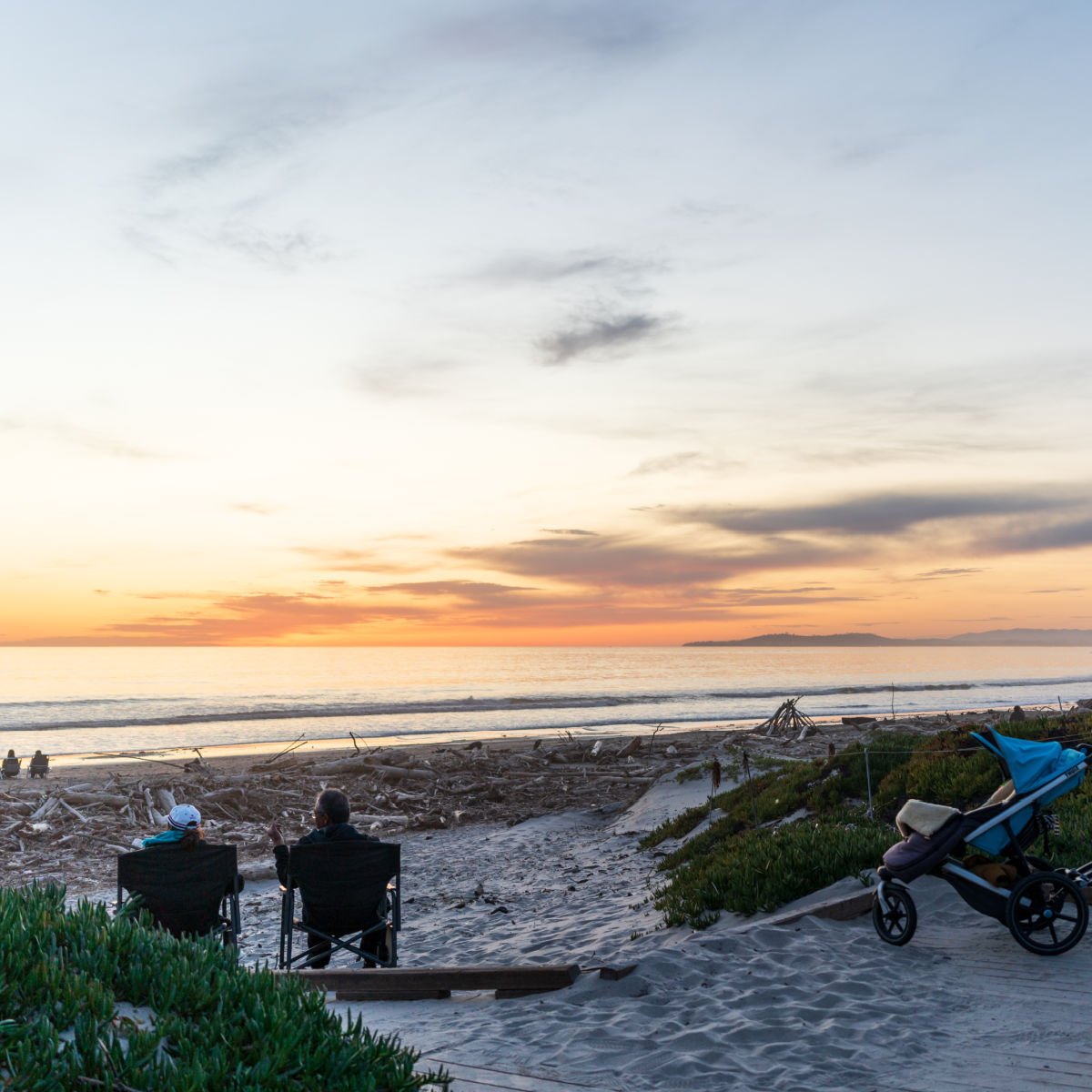 Beachgoers watching sunset in Carpinteria, CA