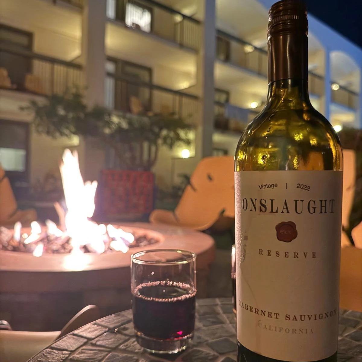 Drinking wine fireside at Palm Mountain Resort & Spa