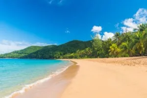 Great beach of Grand Anse near village of Deshaies, Guadeloupe, Caribbean