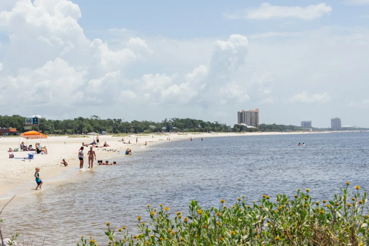 Beachgoers at Ken Combs Pier in Gulfport, MS