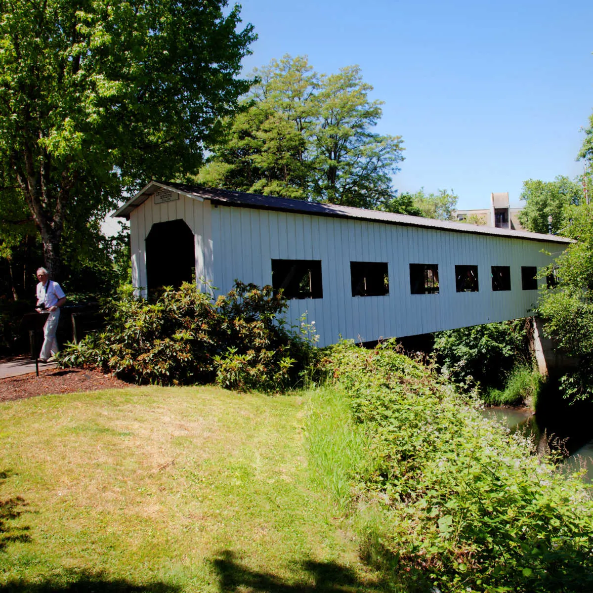 Tourist visiting a covered bridge in Cottage Grove, OR