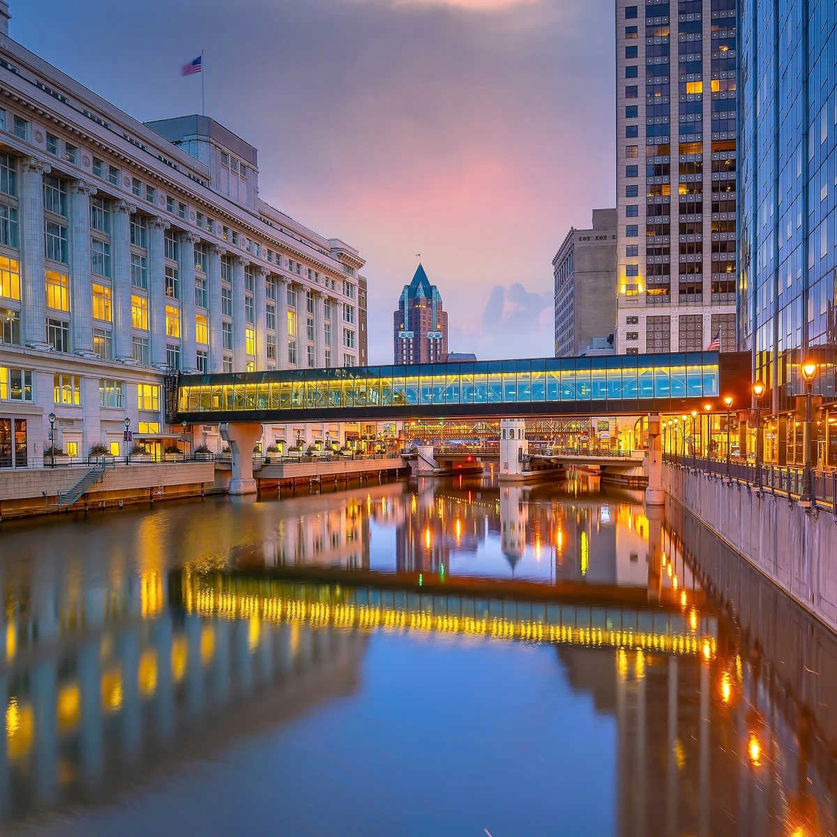 Canal splitting Milwaukee skyline
