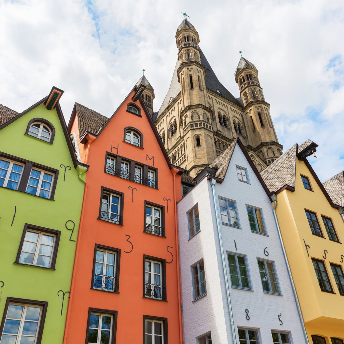 Colorful old buildings and tower in Cologne, Germany
