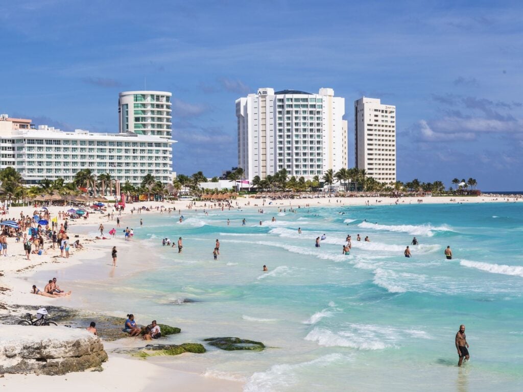Hotel Zone Beach With American Tourists In Cancun Turquiose Blue Water