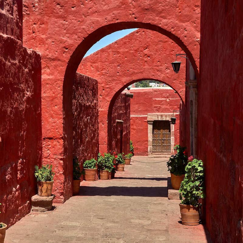 Red Colored Alleyway In The Santa Catalina Monastery In Arequipa, Peru