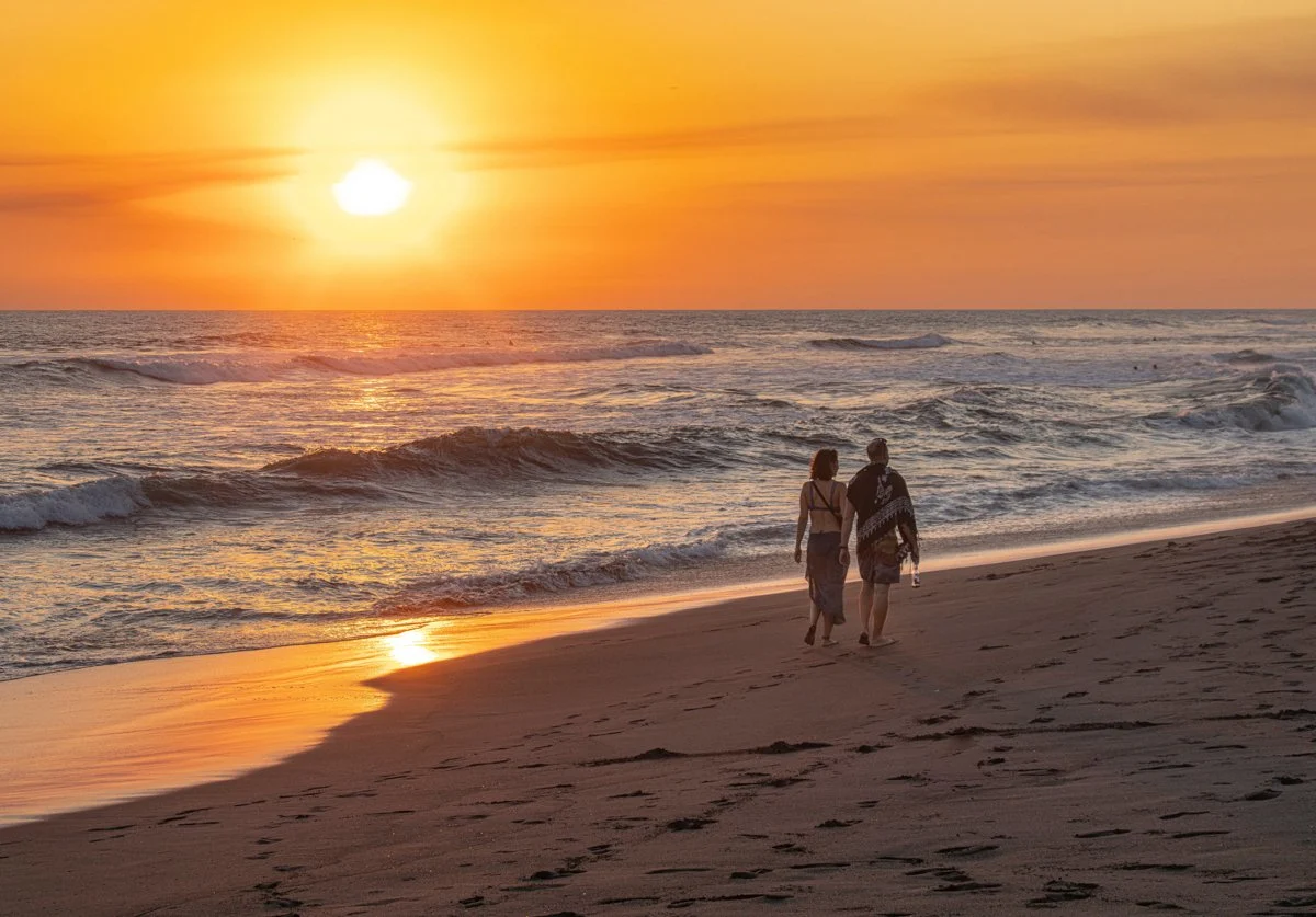 El,Paredon,,Guatemala,-,Couple,Walking,Hand,In,Hand,Along