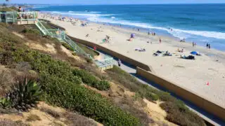 Coastal bluff with stairs from the road to the beach taken in Carlsbad, CA