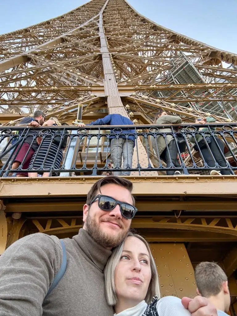 Tyler Fox and Liz Fox on the first level of the Eiffel Tower in Paris, France