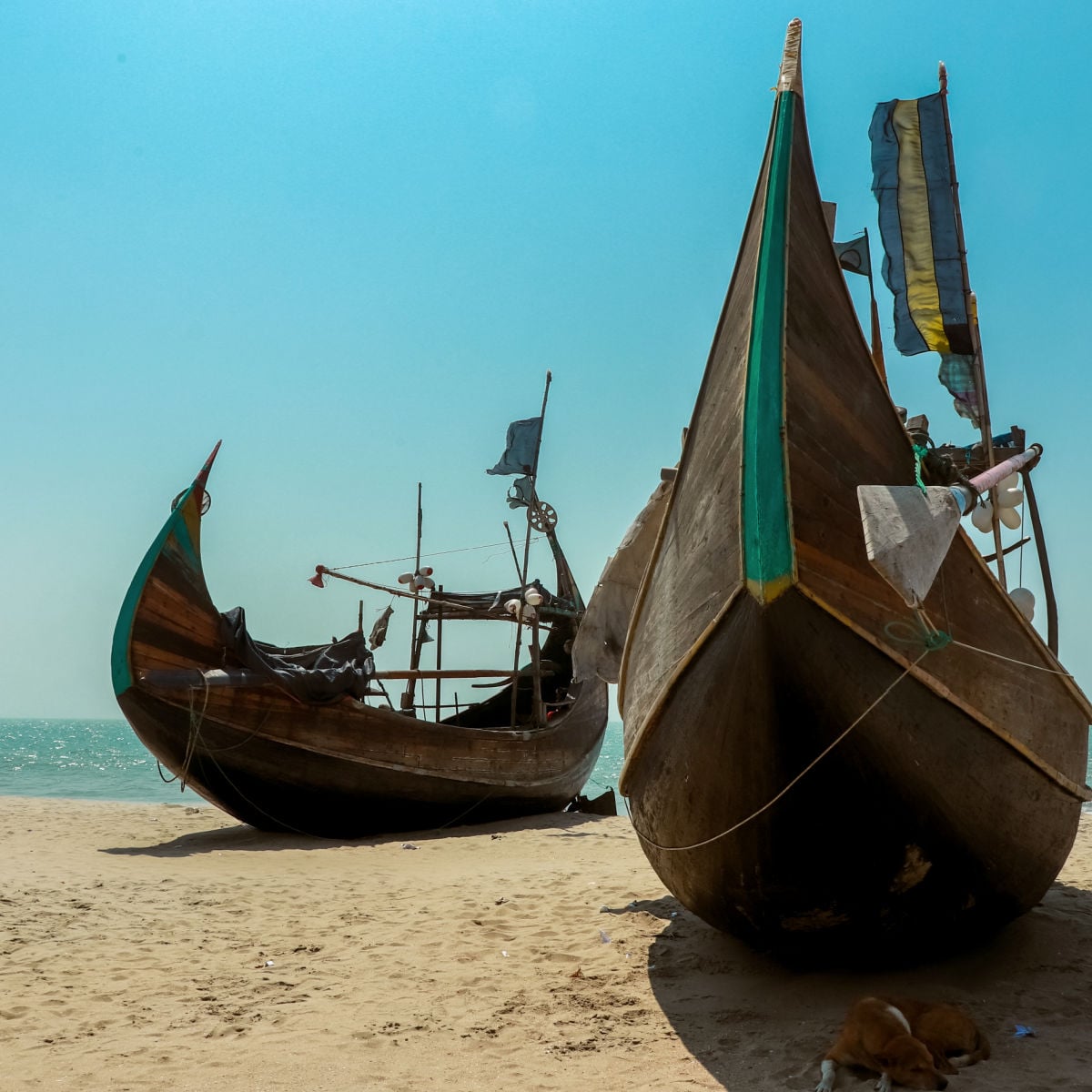 Fishing boats parked on beach in Cox's Bazaar, Bangladesh
