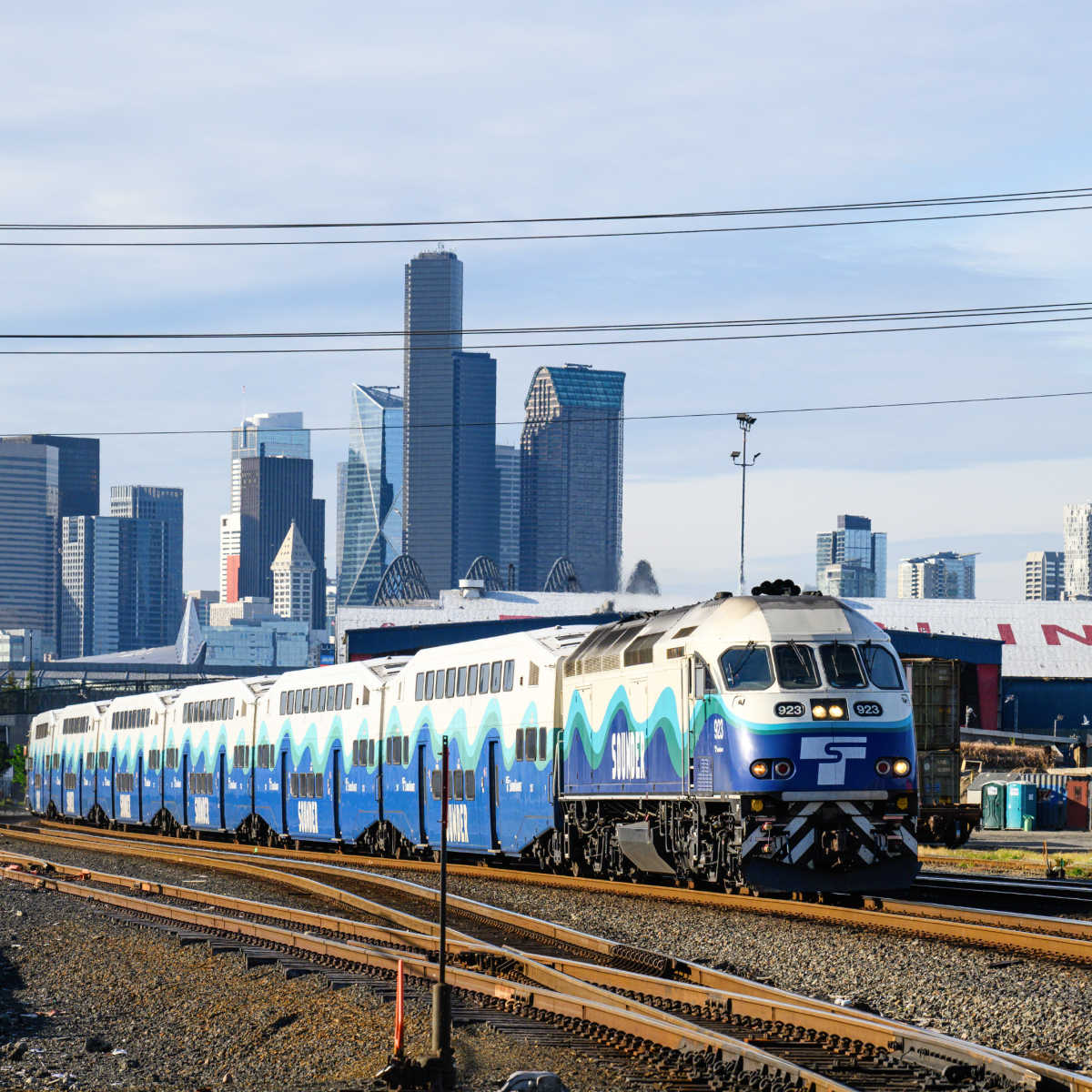Seattle train backdropped by skyline