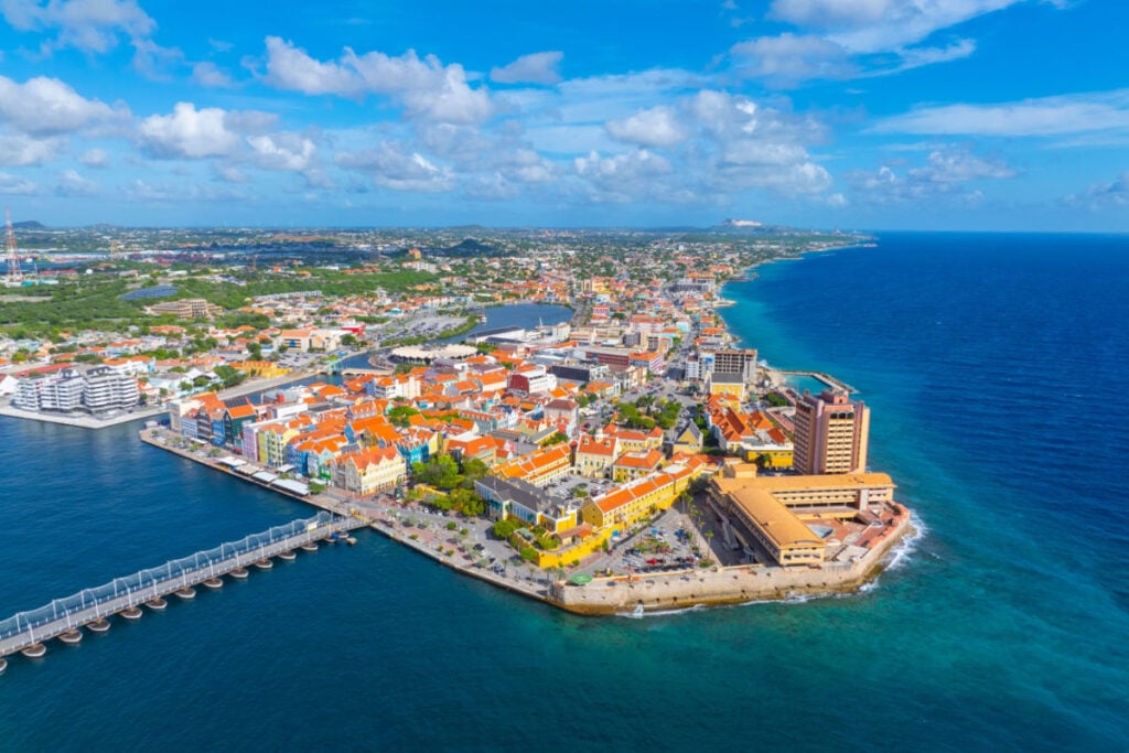Willemstad historic city center aerial view including Handelskade Street in Punda in city of Willemstad, Curacao. Historic Willemstad is a UNESCO World Heritage Site.