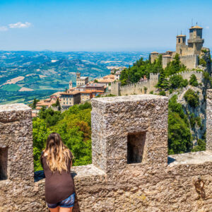 Tourist taking in views of San Marino townscape