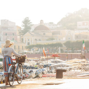 Woman with bike in Ponza, Italy