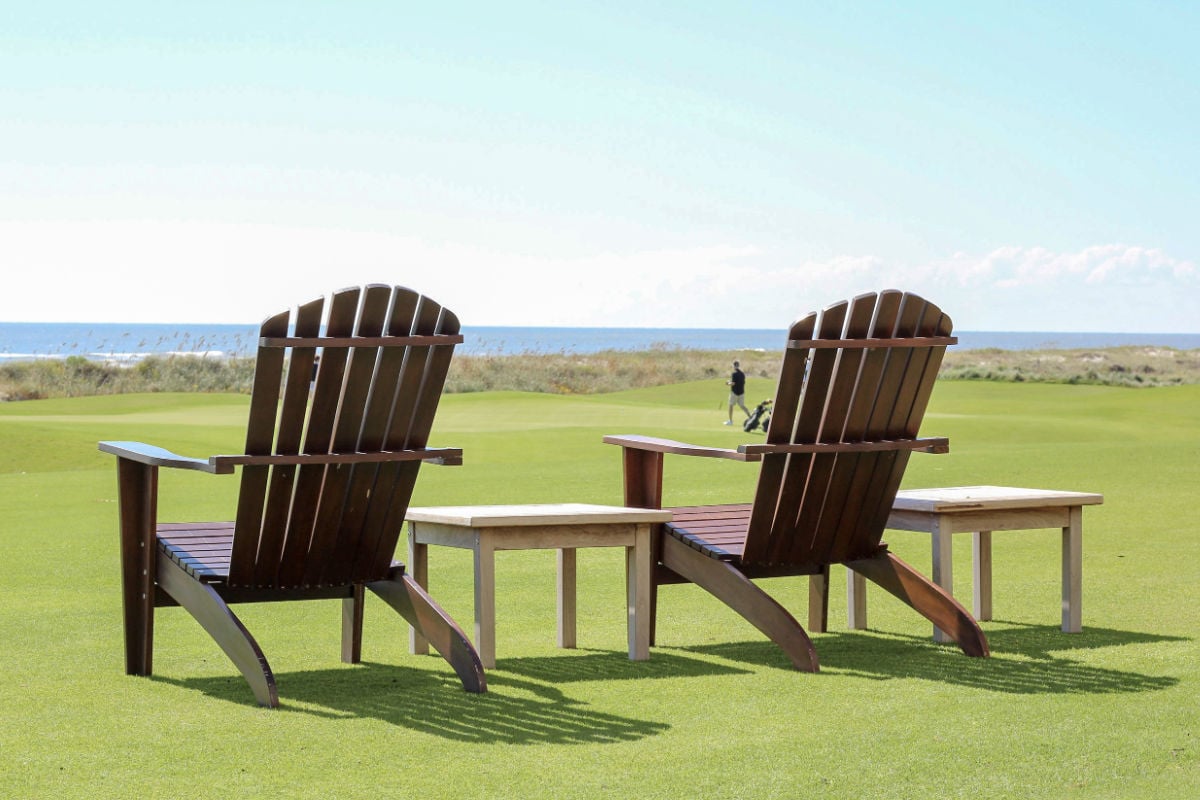 Adirondack chairs sitting on golf course on Kiawah Island, South Carolina outside of Charleston