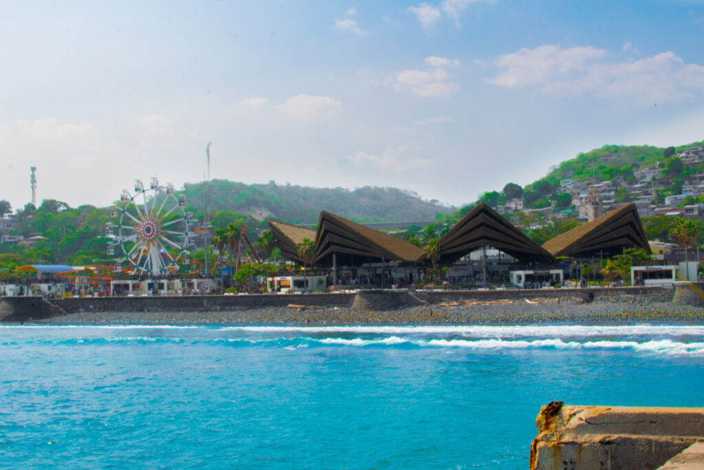Photo of Puerto de la Libertad and Mercado del Mar with the restaurants on the shore and sunset park. surf city