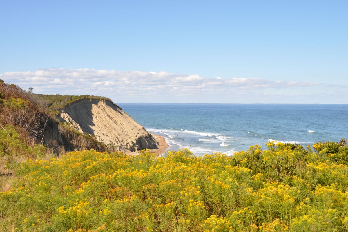 Block Island, off Rhode Island’s coast, features sandy beaches, bluffs, lighthouses, dunes, and scenic bike paths amid a charming, laid-back island atmosphere.