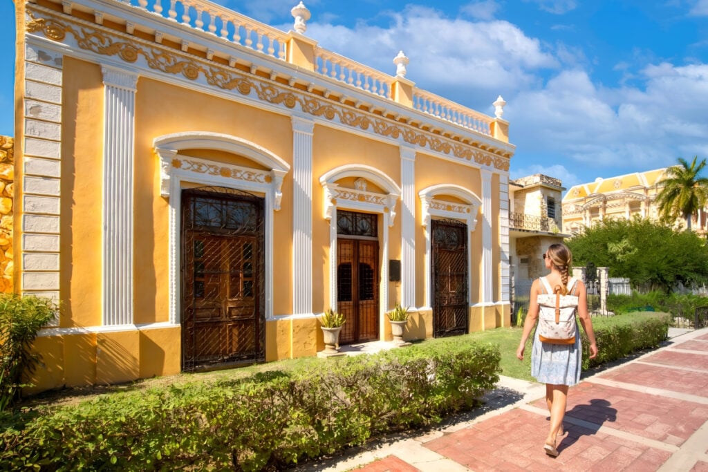 Central Avenue Paseo de Montejo in Merida with local museums, restaurants, monuments and tourist attractions with tourist walking