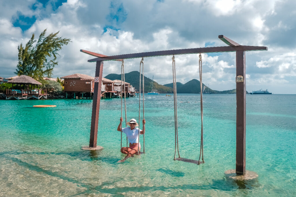 Tourist on swing in Saint Lucia