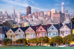 San Francisco's Colorful Victorian homes backdropped by skyline