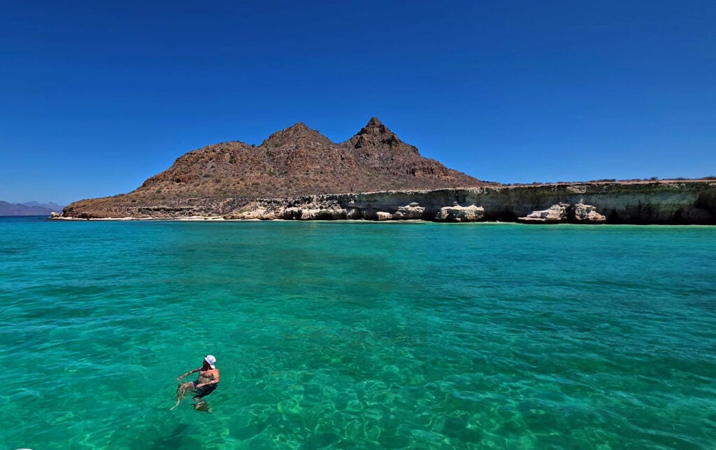 Wading in pristine turquoise waters of Loreto, Mexico